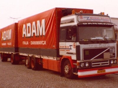 Tekno Tekno Volvo F12 Globetrotter riged truck with 2-axle tilt trailer MOGENS NIELSEN