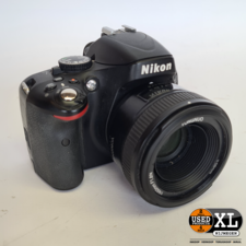 Nikon Camera D5100 met Yongnuo 50mm F/1.8 EF | Nette Staat