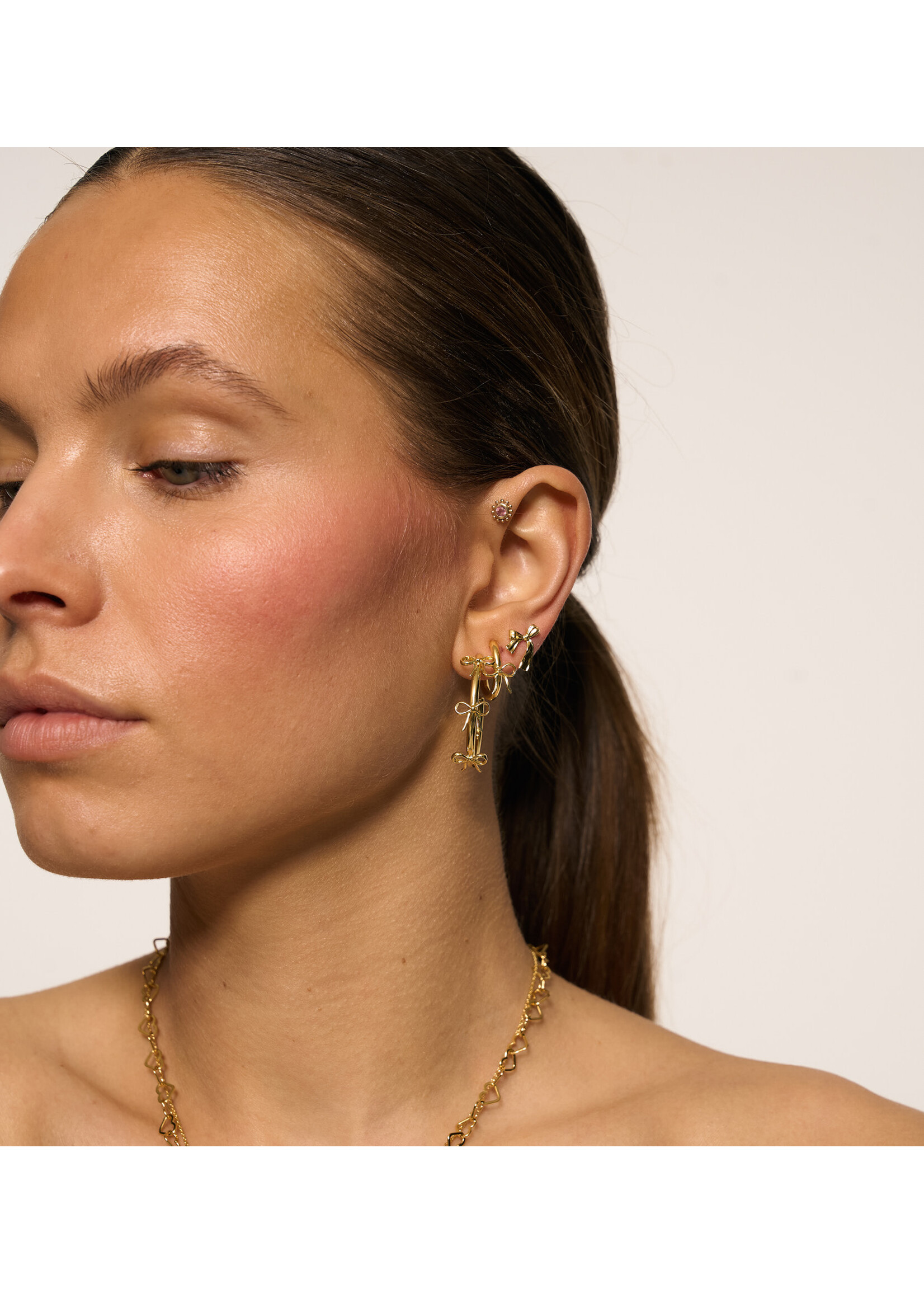 anna+nina Single small bow stud - gold