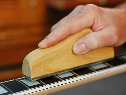 Fret leveler with handle