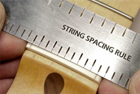 Nut string spacing rule