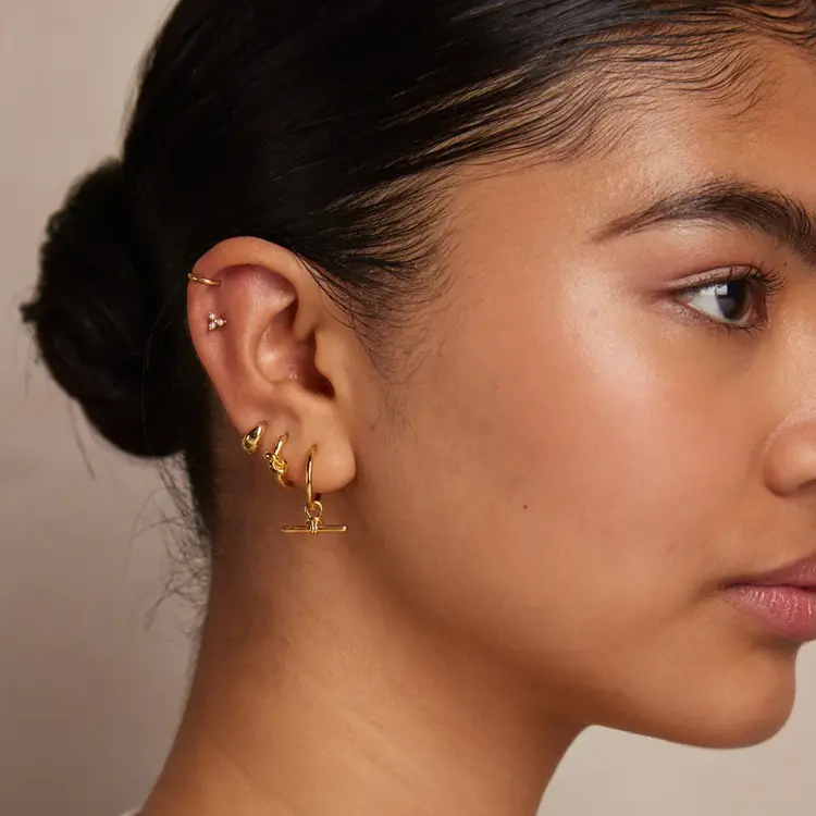 Orelia Polished Knot Huggie Hoop - Pale Gold