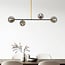 Lampada a sospensione di design Davy a 4 luci con sfere di vetro