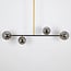 Lampada a sospensione di design Davy a 4 luci con sfere di vetro