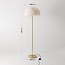 Lampada da terra di design Evania con piume bianche e base in ottone dorato