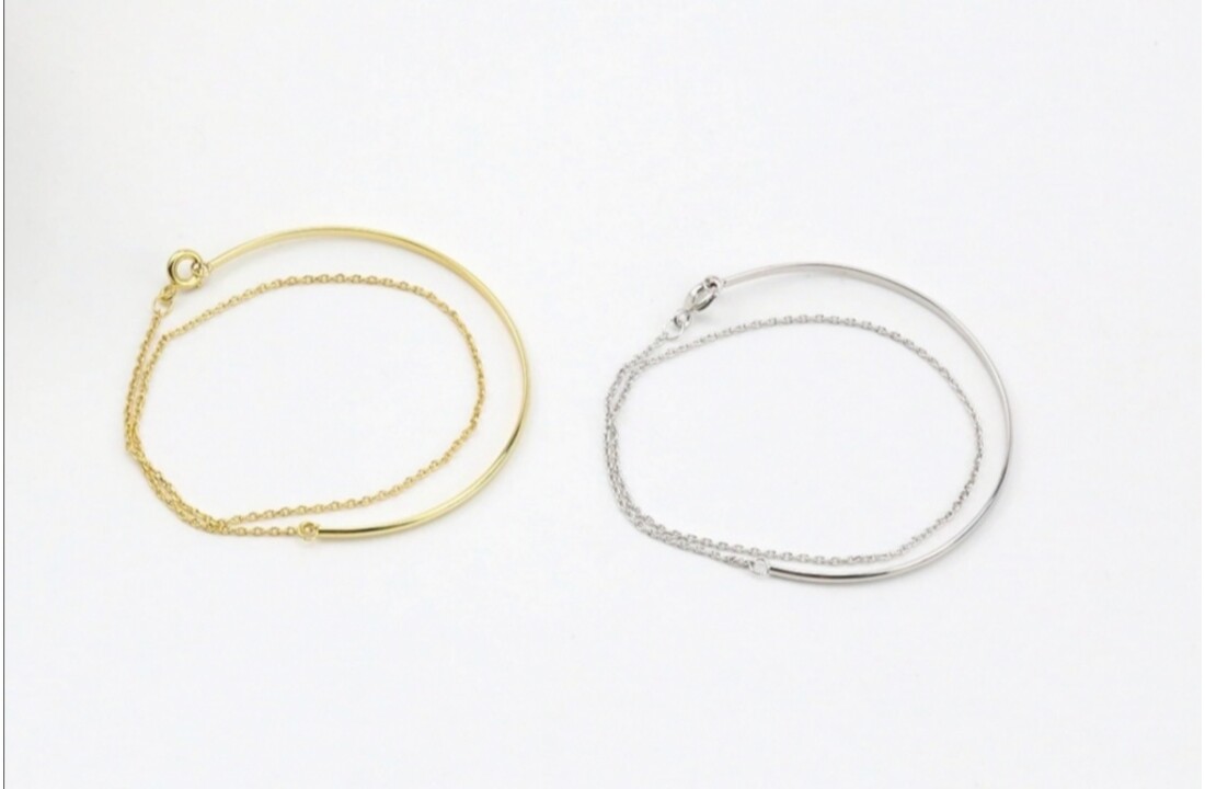 Dubbele minimalisische armband in goud en zilver