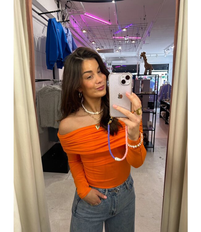 The orange off-shoulder top