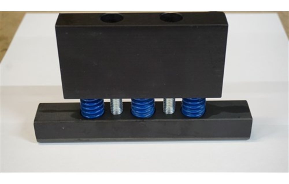 Assy over travel block