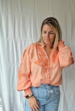 Coral blouse broderie