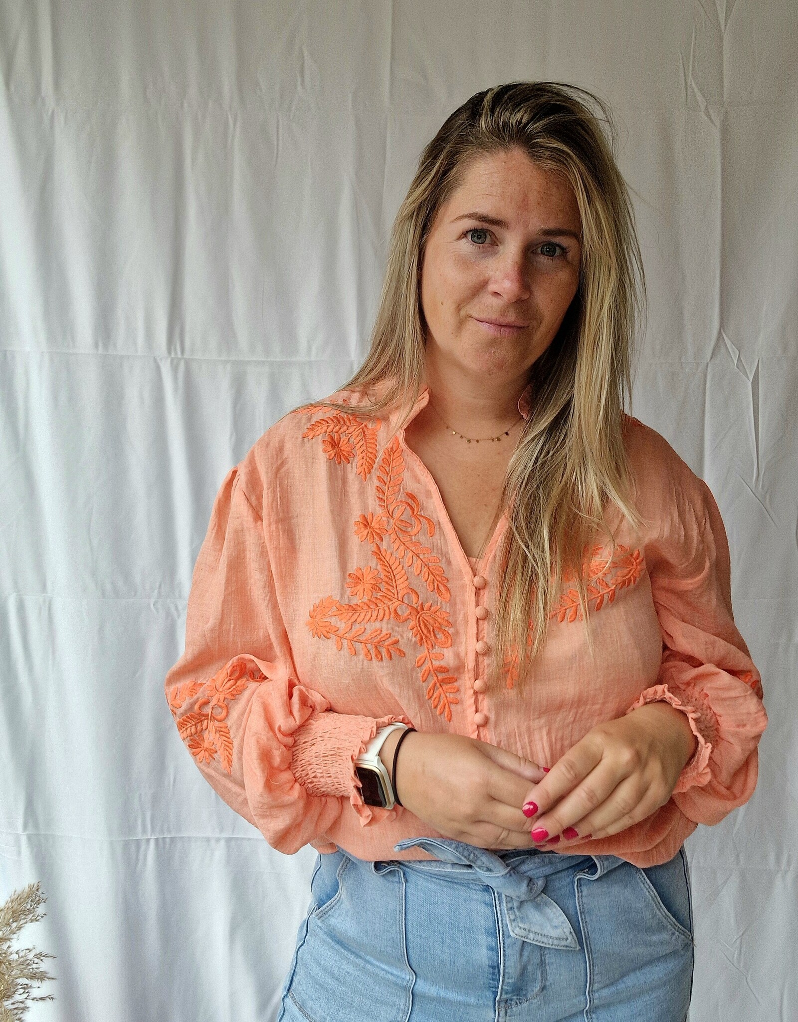 Coral blouse broderie