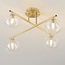 Elegant loftlampe med fire glaskugler - Nymo - guld med klart glas