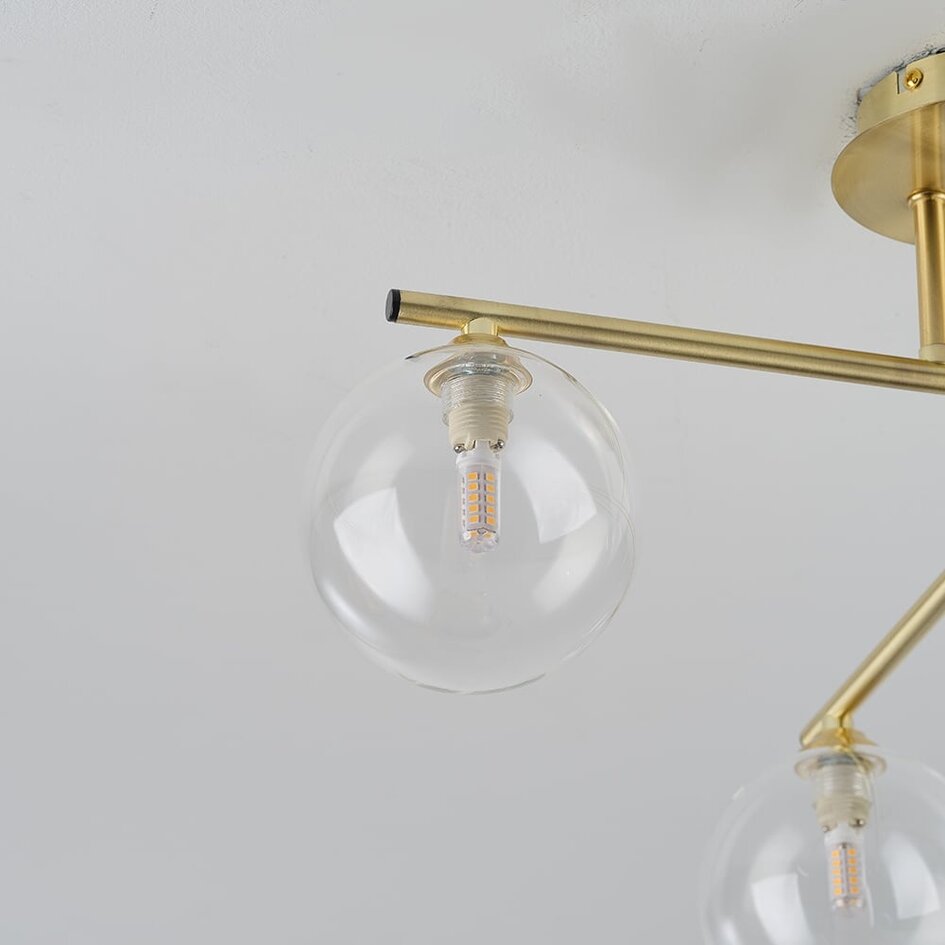 Elegant loftlampe med fire glaskugler - Nymo - guld med klart glas