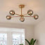 Industriel loftlampe Leah med 5 lyskilder - guld og røgfarvet glas