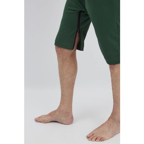 Polo vert foncé avec fermeture à  glissière entre les jambes