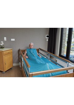 Couverture d'allaitement verte complètement autour du matelas pour les dormeurs agités