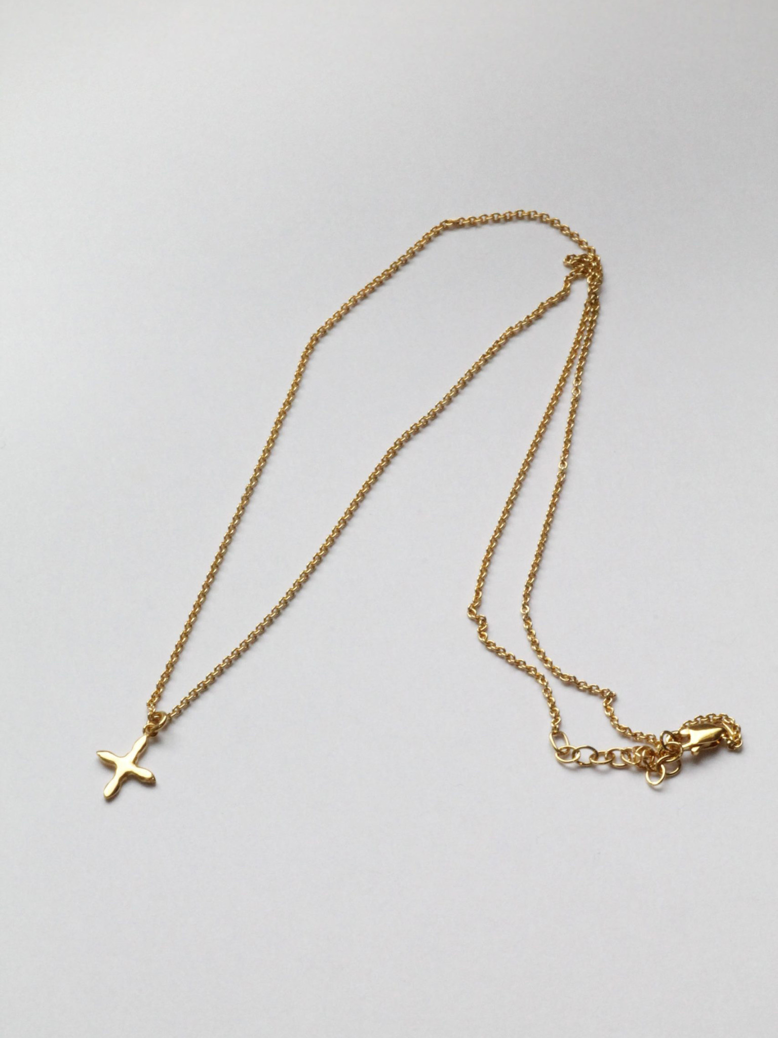 Laure De Mees Cross necklace gold