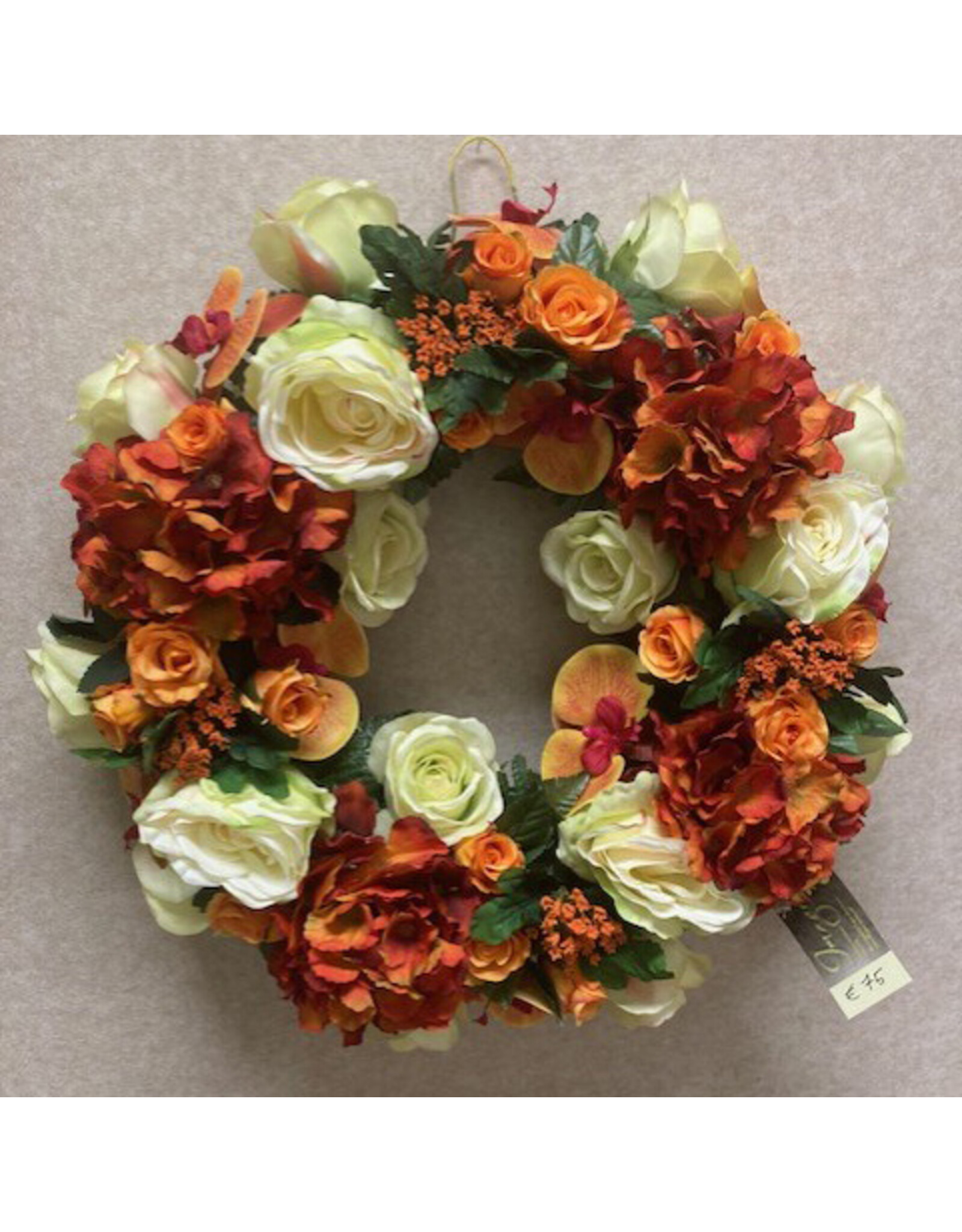 Zijden bloemstuk oranje 75 euro
