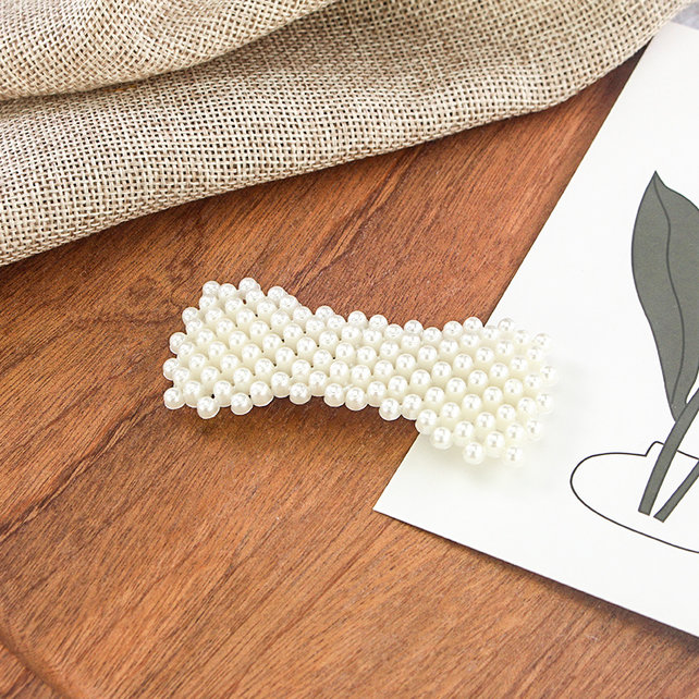 Haarknip offwhite parelstrik *