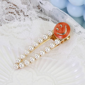 Haarknip offwhite smiley oranje