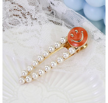 Haarknip offwhite smiley oranje
