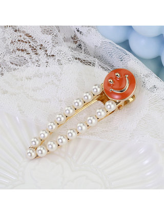 Haarknip offwhite smiley oranje