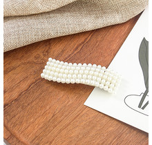 Haarknip met pareltjes golfvorm