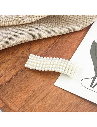 Haarknip met pareltjes golfvorm