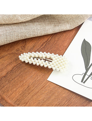 Haarknip met pareltjes binnen in niet