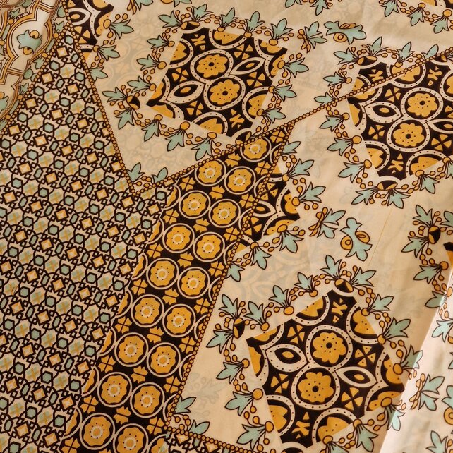 Sjaal met print in oranje/brique met crème