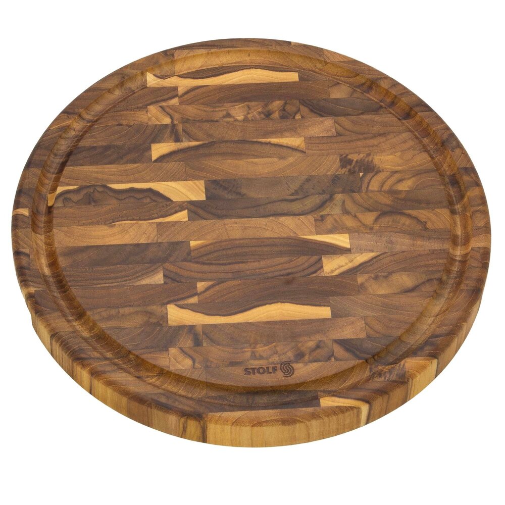 Stolf Massief FSC-gecertificeerde ronde teakhouten snijplank van kopshout met sapgeul en handgrepen, ⌀35 x 3,2 cm Stolf Massief FSC-gecertificeerde ronde teakhouten snijplank van kopshout met sapgeul en handgrepen, ⌀35 x 3,2 cm