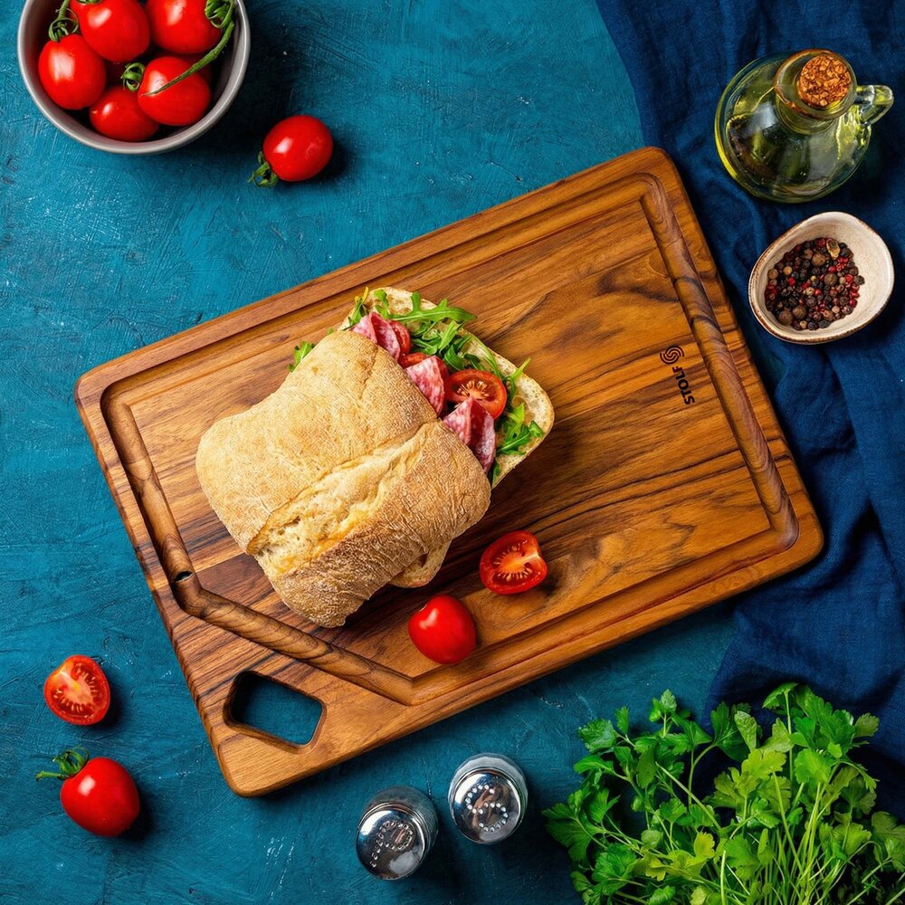Stolf Solid teak serving and cutting board with juice groove and diagonal hole, 36 x 25 x 1.8 cm Stolf Solid teak serving and cutting board with juice groove and diagonal hole, 36 x 25 x 1.8 cm