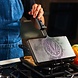 Victoria Cast iron panini and sandwich press with dimpled surface and heat-resistant handle