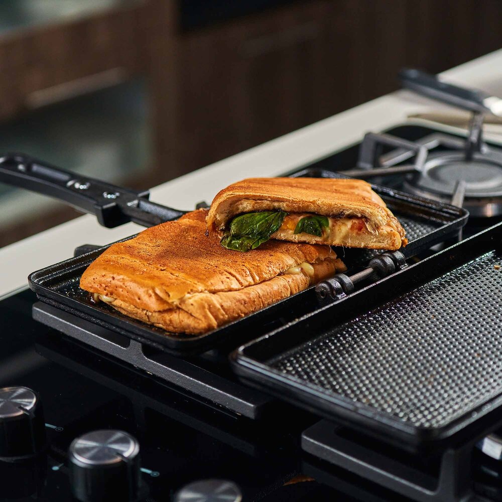 Victoria Cast iron panini and sandwich press with dimpled surface and heat-resistant handle