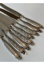 SET OF 8 PEWTER HANDLED CHEESE KNIVES WITH FLORAL MOTIF