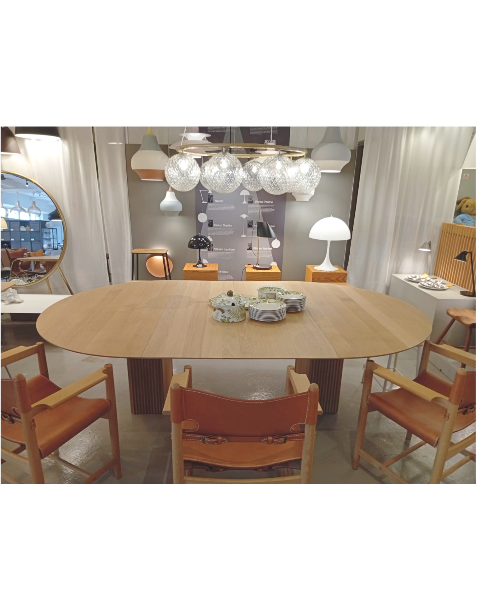 (SHOWROOM ITEM) TEN TABLE (ROUND) WITH 2 EXTENSION LEAVES