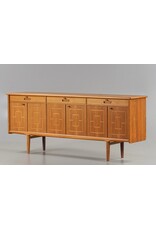 1960'S TEAK SIDEBOARD WITH CARVED RELIEF DOORS