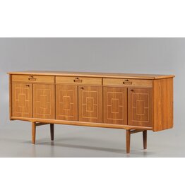 1960'S TEAK SIDEBOARD WITH CARVED RELIEF DOORS