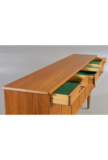 1960'S TEAK SIDEBOARD WITH CARVED RELIEF DOORS