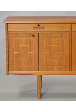 1960'S TEAK SIDEBOARD WITH CARVED RELIEF DOORS