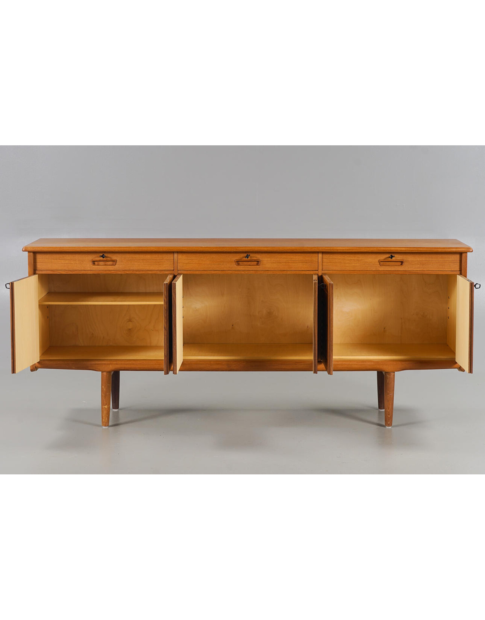 1960'S TEAK SIDEBOARD WITH CARVED RELIEF DOORS