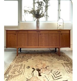 1960'S TEAK SIDEBOARD WITH CARVED RELIEF DOORS