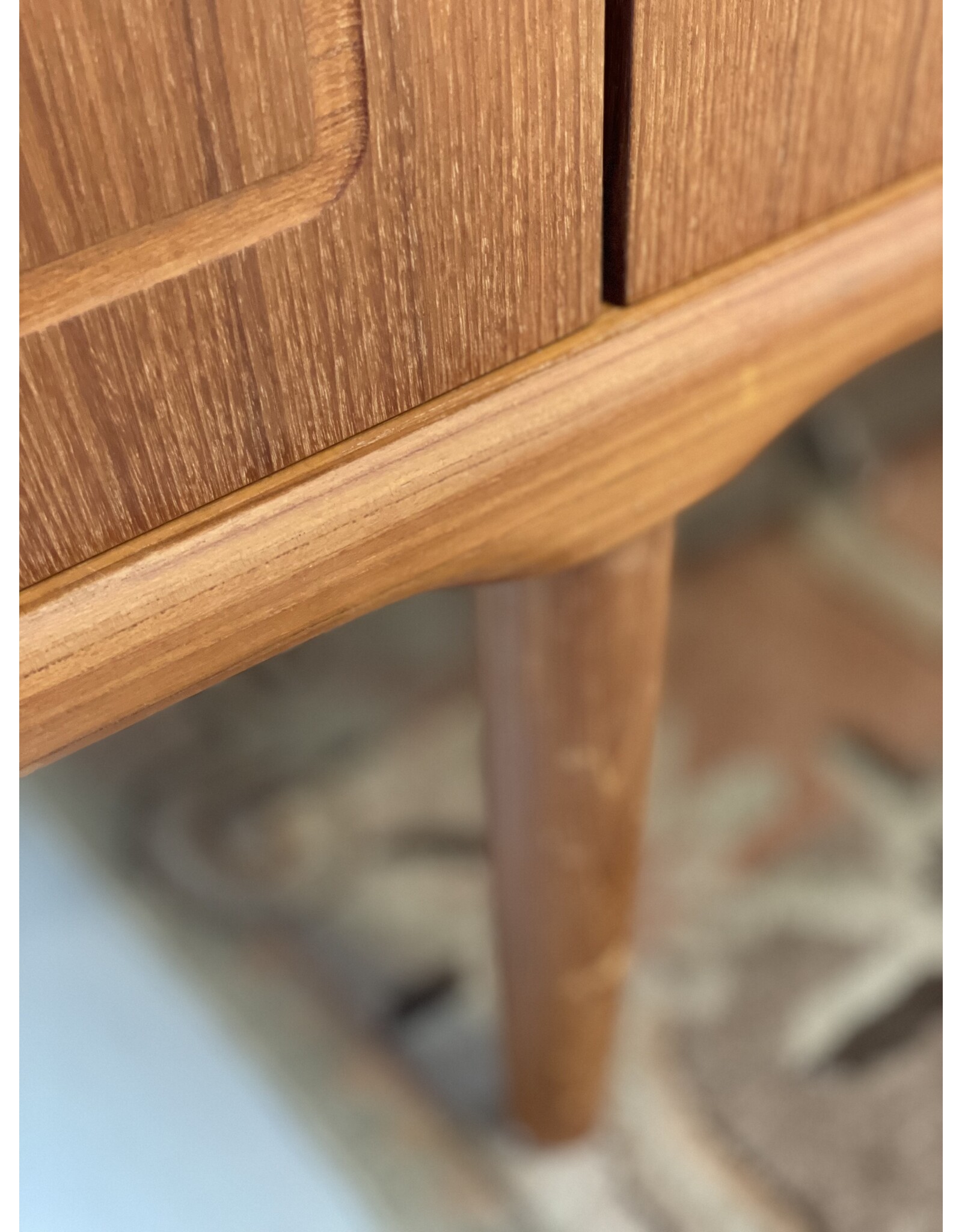 1960'S TEAK SIDEBOARD WITH CARVED RELIEF DOORS