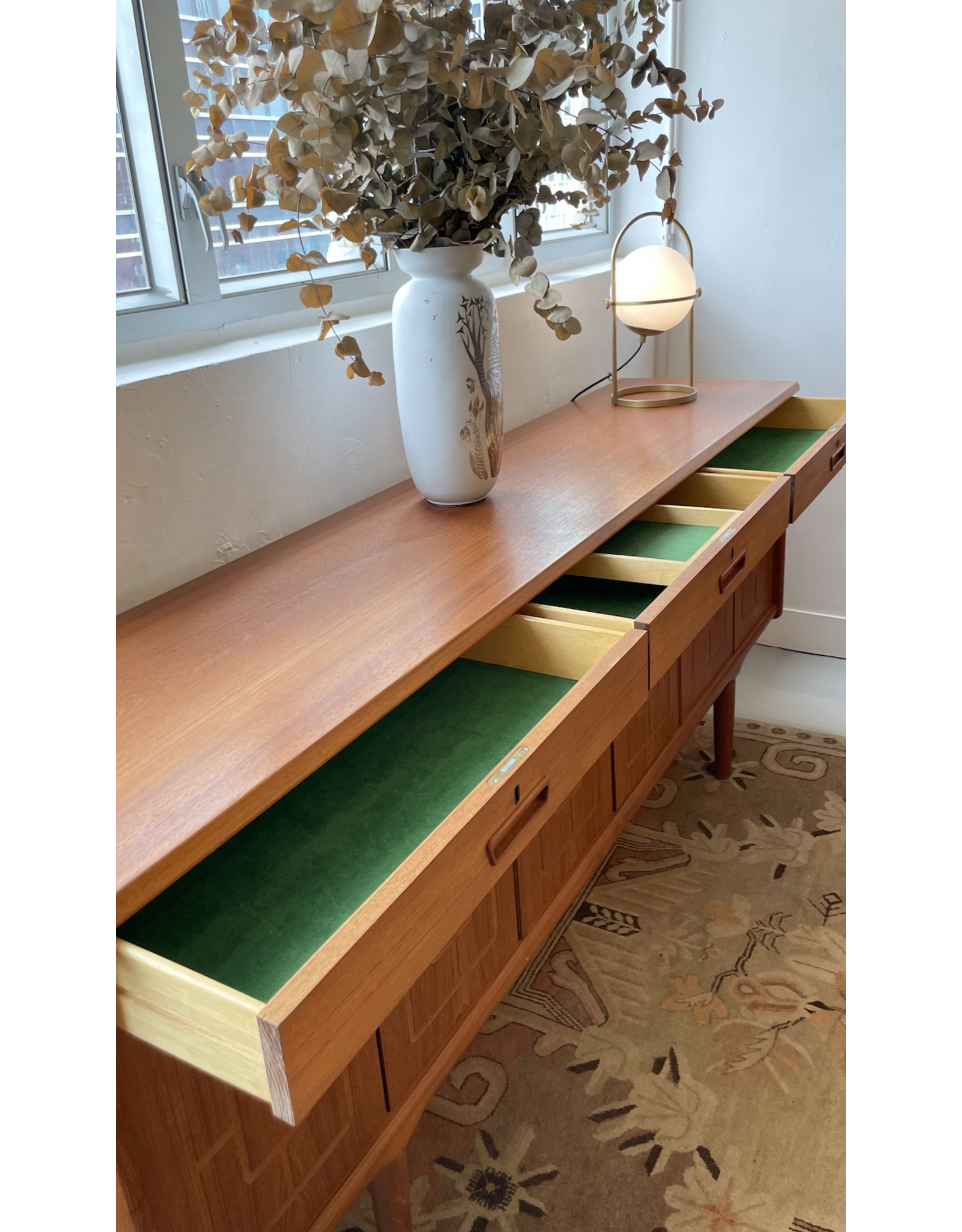 1960'S TEAK SIDEBOARD WITH CARVED RELIEF DOORS