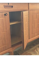 1960'S TEAK SIDEBOARD WITH CARVED RELIEF DOORS