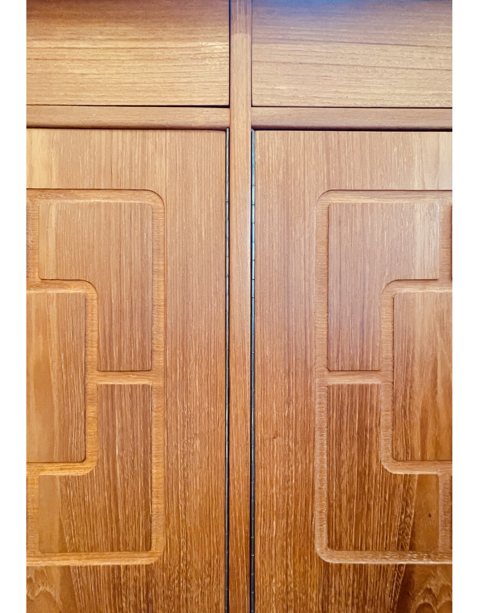 1960'S TEAK SIDEBOARD WITH CARVED RELIEF DOORS