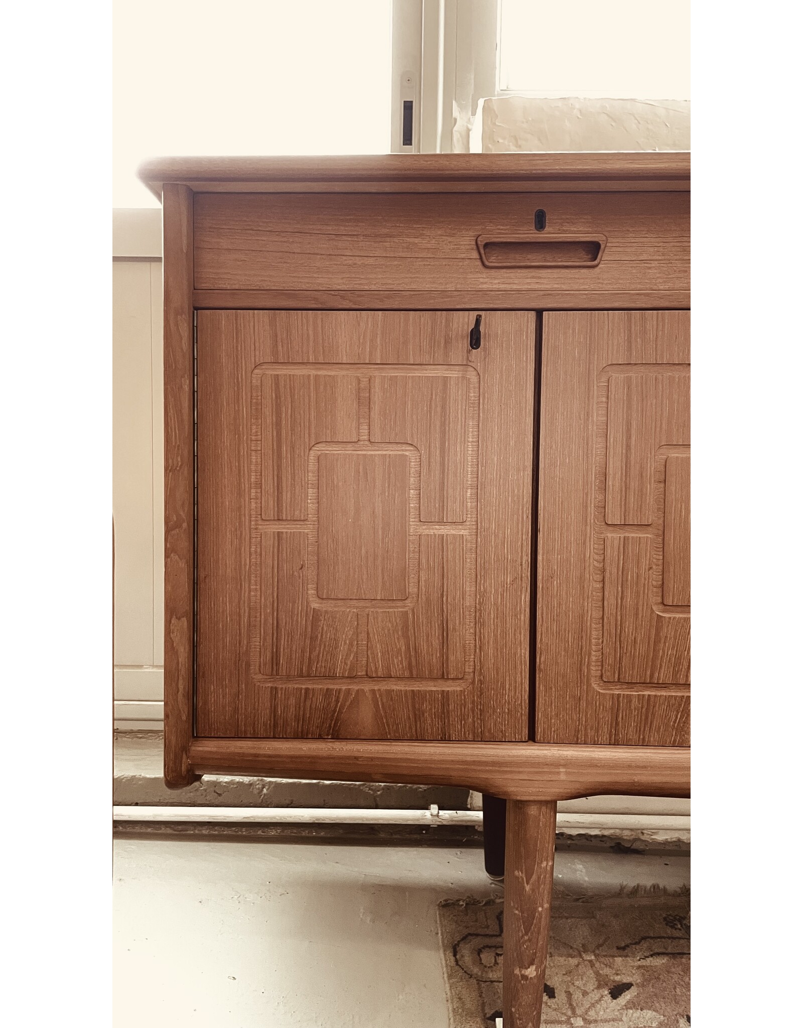 1960'S TEAK SIDEBOARD WITH CARVED RELIEF DOORS