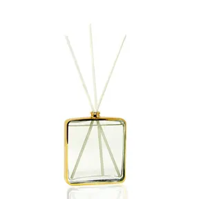 Diffuseur de forme carrée avec cadre doré, parfum « Muguet »
