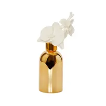 Gold Bottle Diffuser With  White Flower Cap