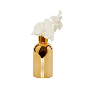 Gold Bottle Diffuser With  White Flower Cap