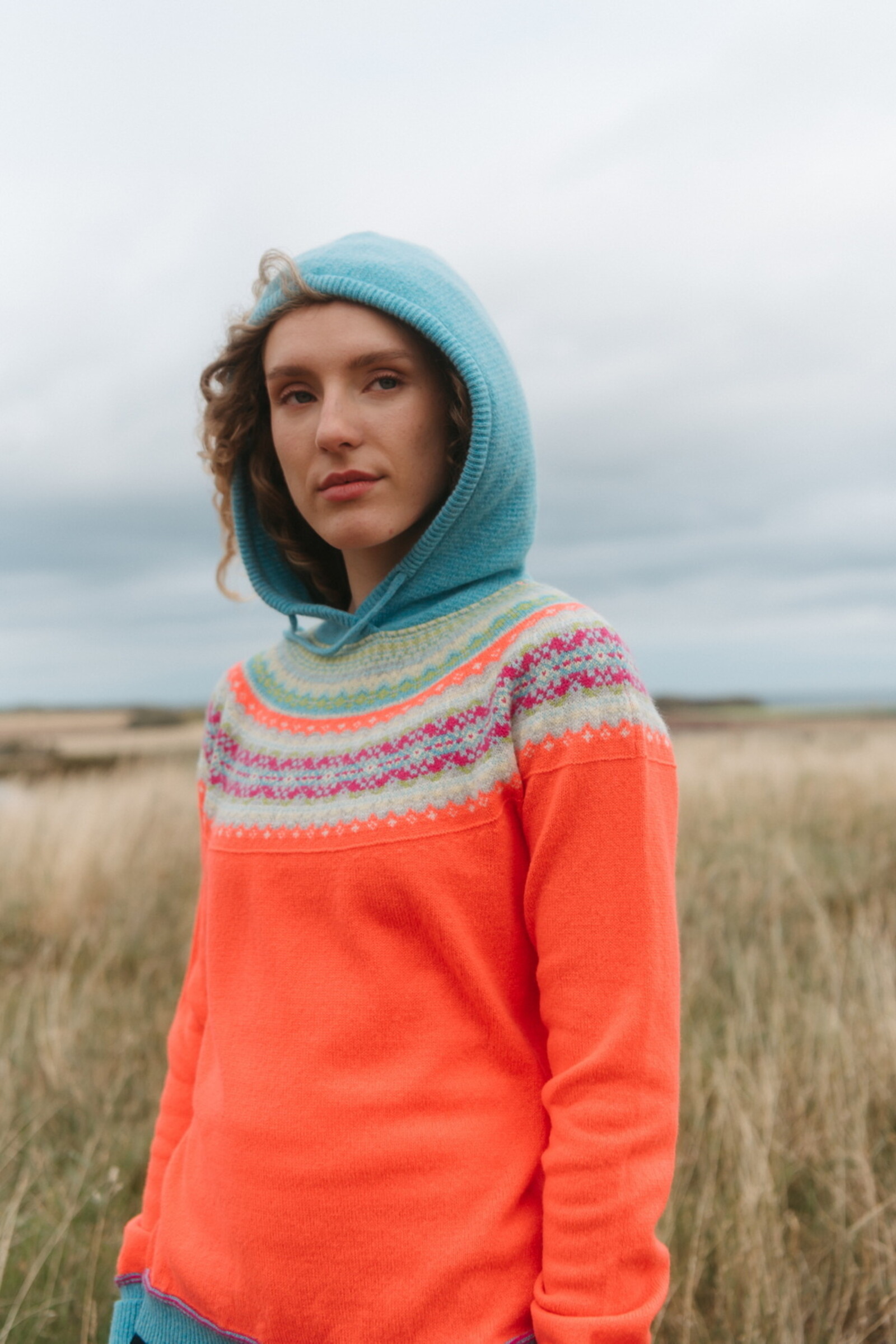 Eribé Eribé - Alpine Hoody Sweater Amelia | Oranger Kapuzenpullover aus 100 % Merinowolle